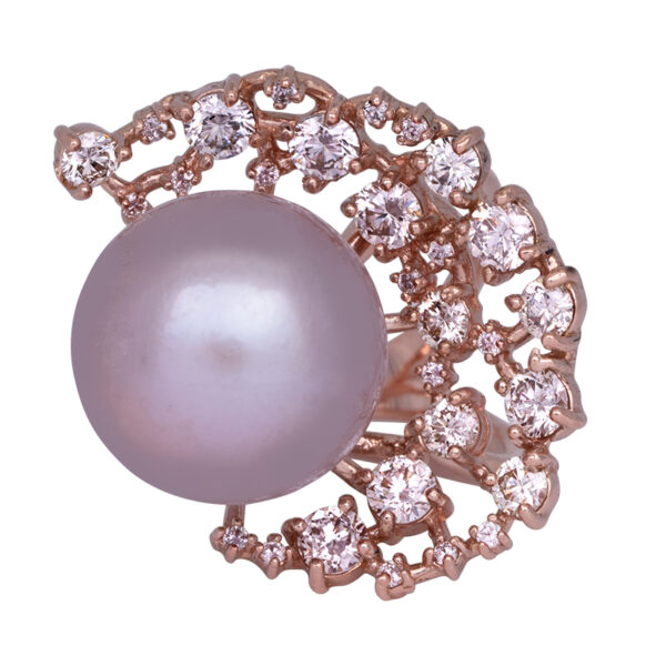 rose gold freeform ring with a large pink pearl surrounded by a crescent of round brilliant diamonds