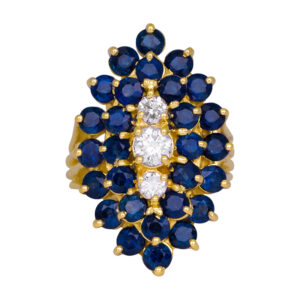 yellow gold cluster ring in a marquise shape with round blue sapphires and diamonds in the center