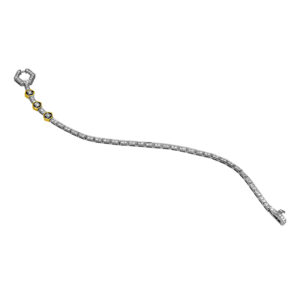 white gold tennis bracelet with round brilliant diamonds, fancy hex shaped clasp with 3 hex yellow gold bezels near the clasp