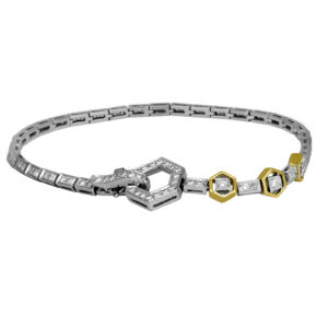 white and yellow gold tennis bracelet with geometric hexagon motifs and set with round brilliant diamonds
