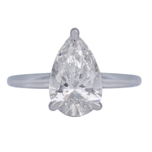 white gold solitaire engagement ring centered with a pear shaped diamond