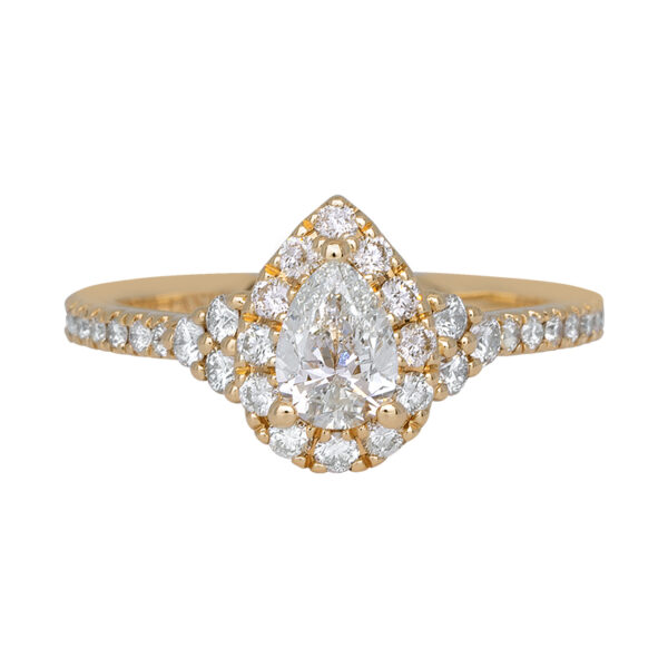 yellow gold engagement set with a pear diamond and diamond halo and diamonds in the band