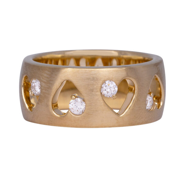 yellow gold wide band with cut-out hearts set with one diamond in a corner of each heart