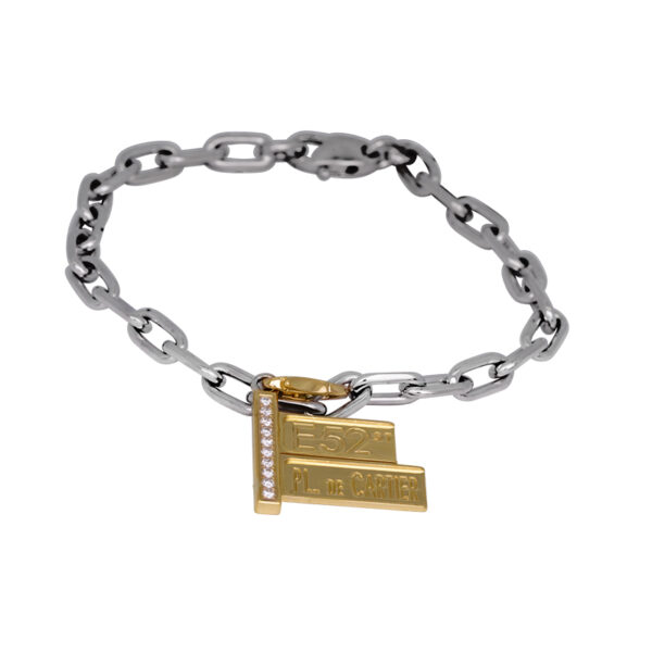 white gold link bracelet with a yellow gold street sign charm with round brilliant diamonds