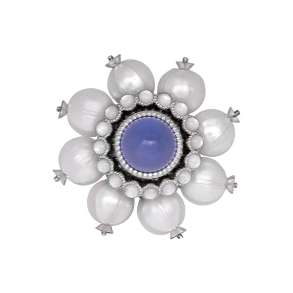 white gold ring centered with blue chalcedony round cabochon surrounded by round mother-of-pearl and pearl haloes