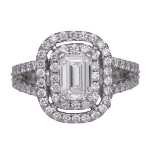 platinum double halo engagement ring centered with an emerald cut diamond surrounded by round brilliant diamonds