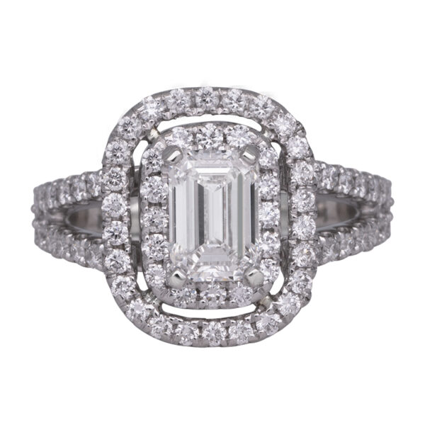 platinum double halo engagement ring centered with an emerald cut diamond surrounded by round brilliant diamonds