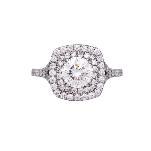 white gold engagement ring with a round brilliant triple excellent diamond surrounded by a double cushion shaped diamond halo