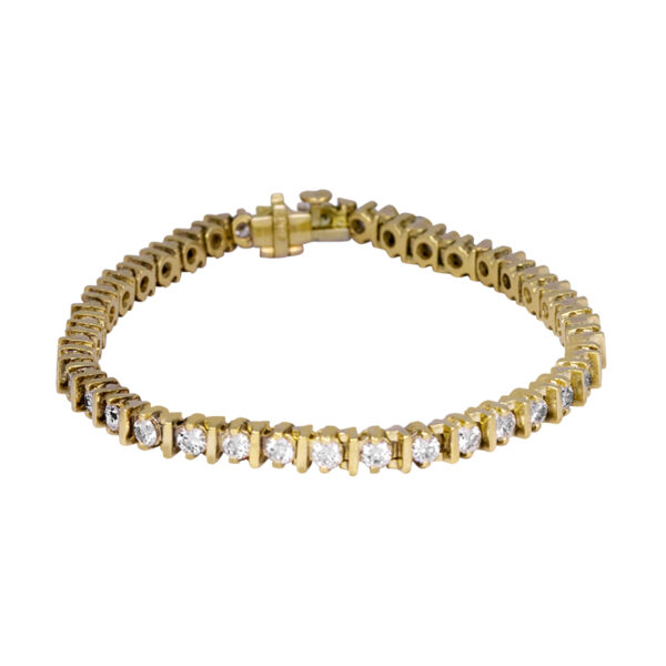 yellow gold tennis bracelet set with diamonds