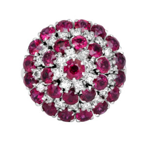 round cocktail ring set with round rubies and diamonds, alternating outwards like a target