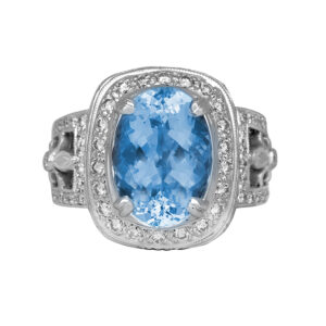 white gold halo ring centered with an oval aquamarine surrounded by a diamond halo