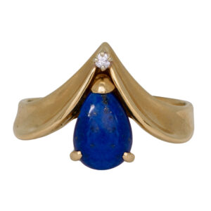 yellow gold curved ring with a pear cabochon lapis and a small round brilliant diamond