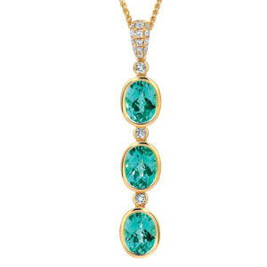 yellow gold pendant set with 3 oval blue-green chrysoberyls and small round brilliant diamonds