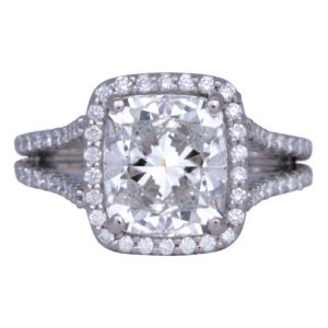 white gold halo engagement ring set with a large cushion diamond surrounded by a diamond halo and diamonds in the band