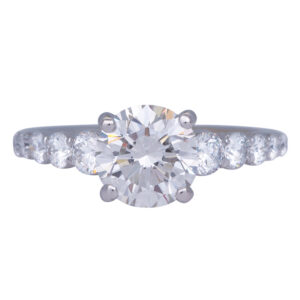 white gold tapered engagement ring centered with a round brilliant diamond and graduated diamonds in the band