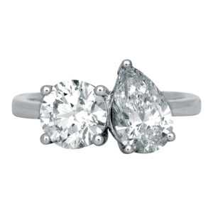 white gold toi et moi ring set with a round brilliant and a pear diamond