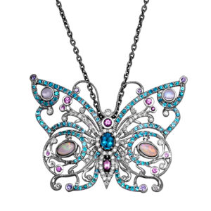 white gold butterfly pendant with paraiba tourmaline, sapphire, opal, moonstone, and diamonds