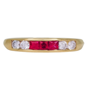yellow gold ring set with princess rubies and round brilliant diamonds