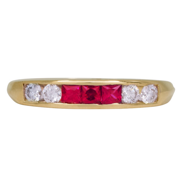 yellow gold ring set with princess rubies and round brilliant diamonds