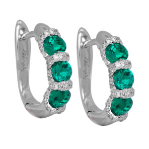white gold huggie hoop earrings set with round brilliant emeralds and small round brilliant diamonds