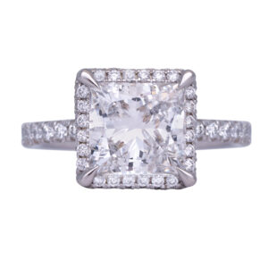white gold halo engagement ring centered with a large princess diamond surrounded by round diamonds in the halo and band