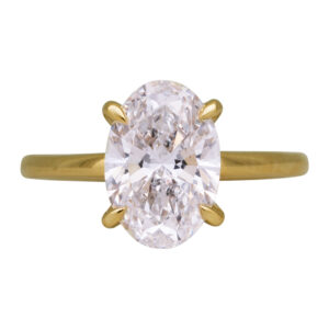 yellow gold under halo engagement ring centered with an oval diamond