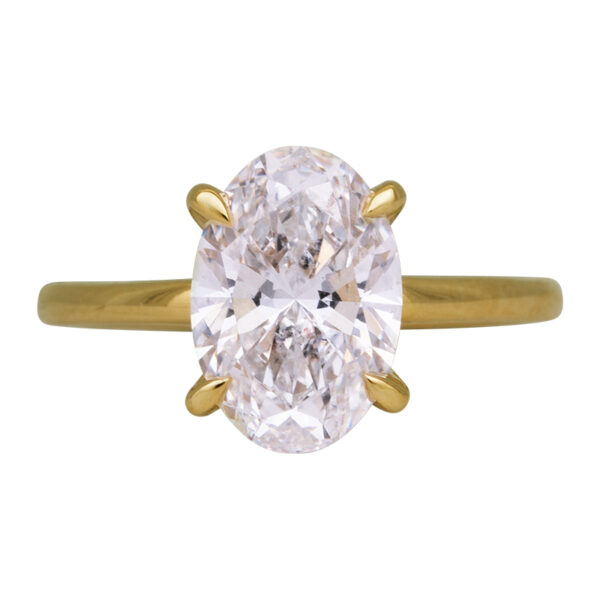 yellow gold under halo engagement ring centered with an oval diamond
