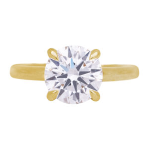 yellow gold under-halo engagement ring set with a round brilliant diamond and round diamonds in the under-halo
