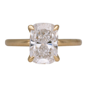 yellow gold under halo engagement ring set with a cushion cut diamond