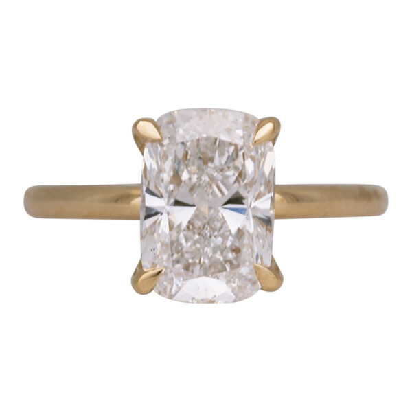 yellow gold under halo engagement ring set with a cushion cut diamond