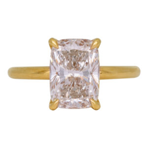 yellow gold solitaire engagement ring set with a rectangular radiant diamond