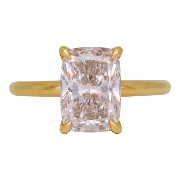 yellow gold solitaire engagement ring set with a rectangular radiant diamond