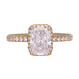 yellow gold halo engagement ring centered with an elongated cushion diamond surrounded by diamonds in the halo and band