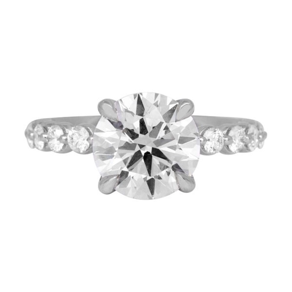 white gold engagement ring set with a large round brilliant diamond and round brilliant diamonds in the band