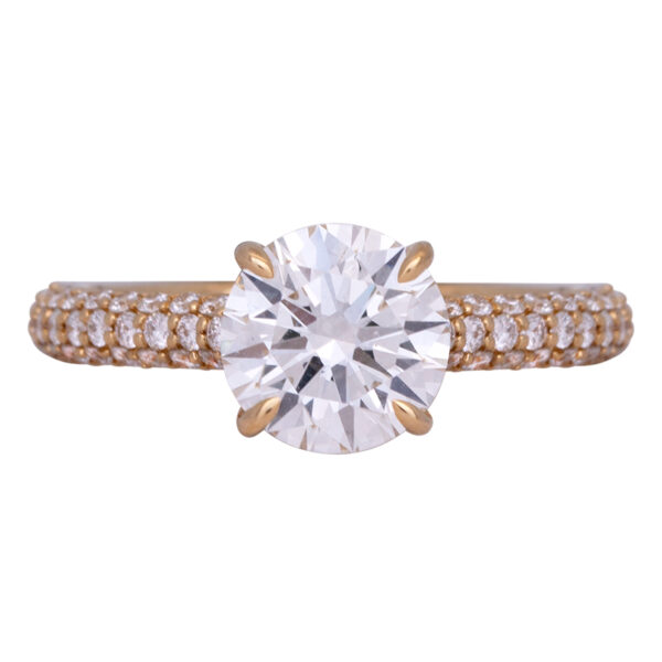 yellow gold engagement ring set with a round brilliant diamond, under halo, and diamonds in the band