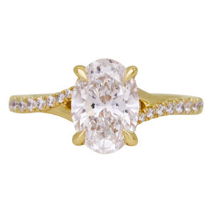 yellow gold under halo engagement ring centered with an oval diamond and set with diamonds in the band