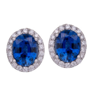 white gold halo earring studs with oval blue sapphires surrounded by diamond haloes