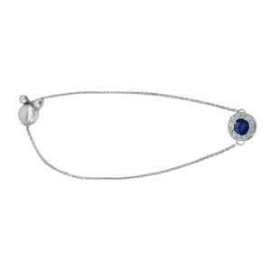 white gold halo pendant set with a round blue sapphire and round brilliant diamond halo