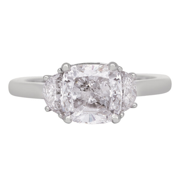 white gold 3-stone engagement ring centered with a large cushion diamond flanked by 2 small half-moon diamonds