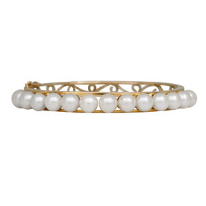 yellow gold cuff bracelet set with pearl tendrils
