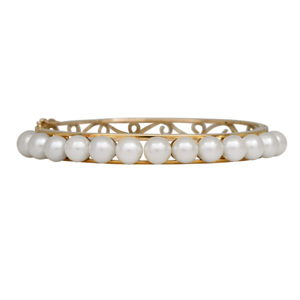 yellow gold cuff bracelet set with pearl tendrils