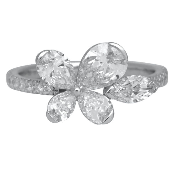 white gold flower motif ring set with pear, marquise, and round brilliant diamonds