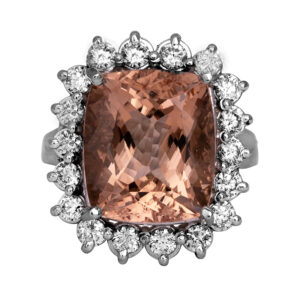 white gold halo ring with a large cushion peach morganite surrounded by round diamonds