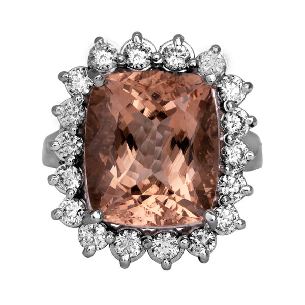 white gold halo ring with a large cushion peach morganite surrounded by round diamonds