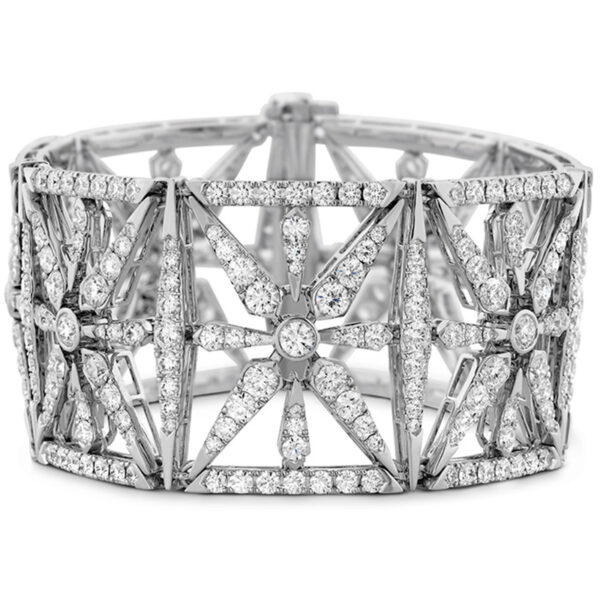 white gold wide cuff bracelet with star motif set with 22 carats of round brilliant diamonds