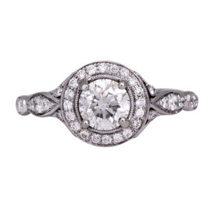 platinum halo ring centered with a round diamond and diamonds in the halo and band