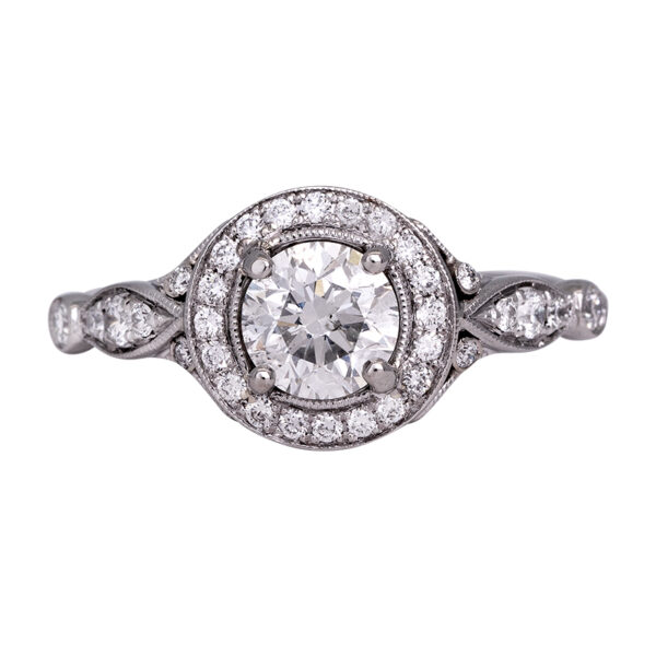 platinum halo ring centered with a round diamond and diamonds in the halo and band