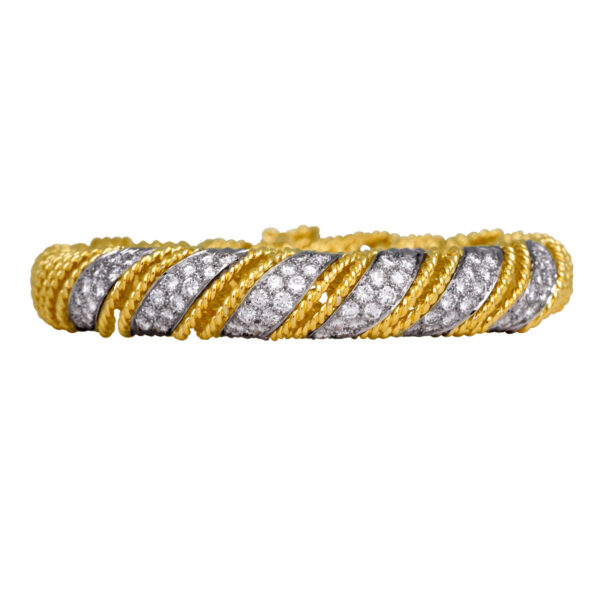 retro white and yellow gold woven bracelet set with round diamonds