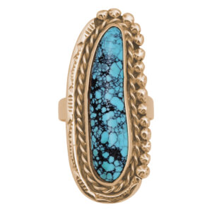 yellow gold ring set with an elongated irregular cabochon turquoise