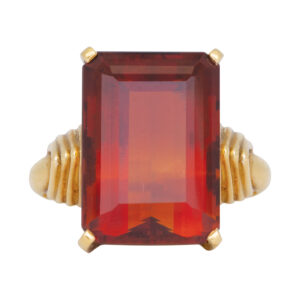 yellow gold ring set with a large emerald cut deep orange Madeira citrine
